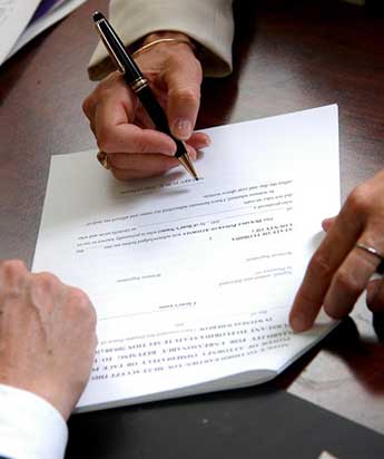 Man Signing a Document